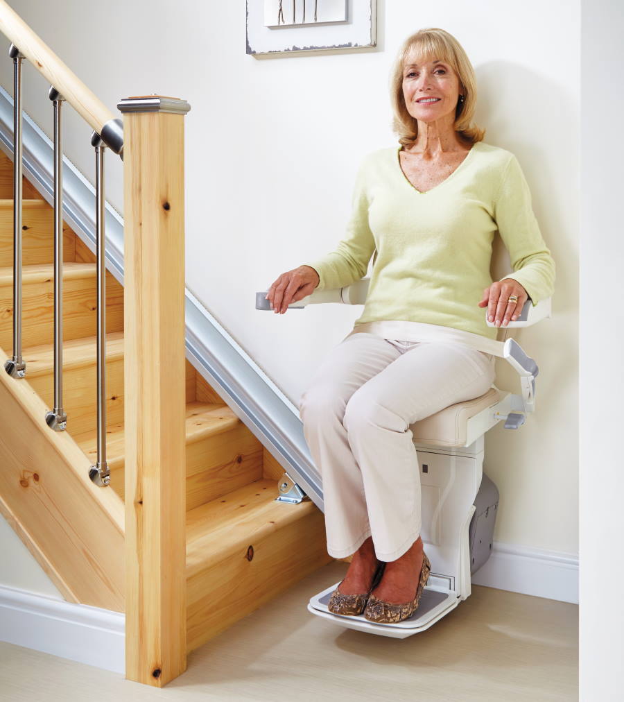 Woman on affordable stairlift in Milwaukee, WI woman on affordable stairlift WI