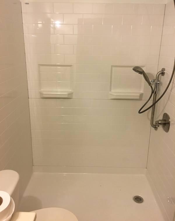 Madison subway tile fiberglass roll in shower