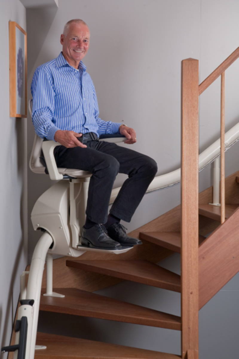 Milwaukee man on curved stairlift Waukesha WI